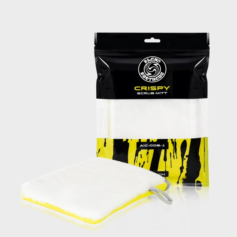 Dwustronna rękawica czyszcząca Crispy Scrub Mitt obok opakowania na limonkowym tle.