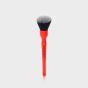Pędzelek Zippy zaprezentowany na czarnym opakowaniu strunowym na jaskrawym magentowym tle