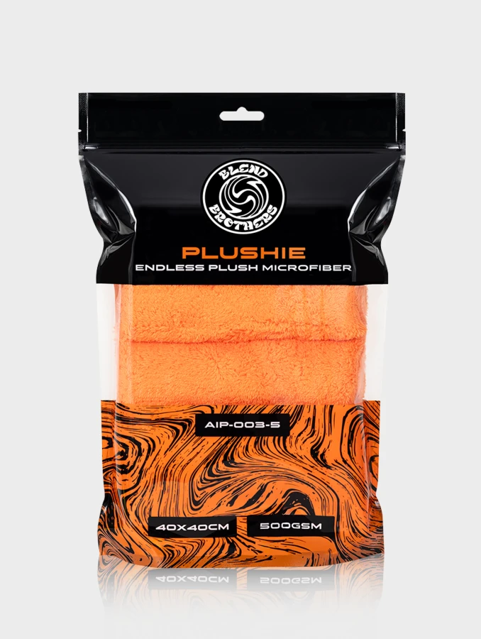 Czarno-pomarańczowe opakowanie zbiorcze 5 sztuk mikrofibry Plushie na jasnym tle z odbiciem.